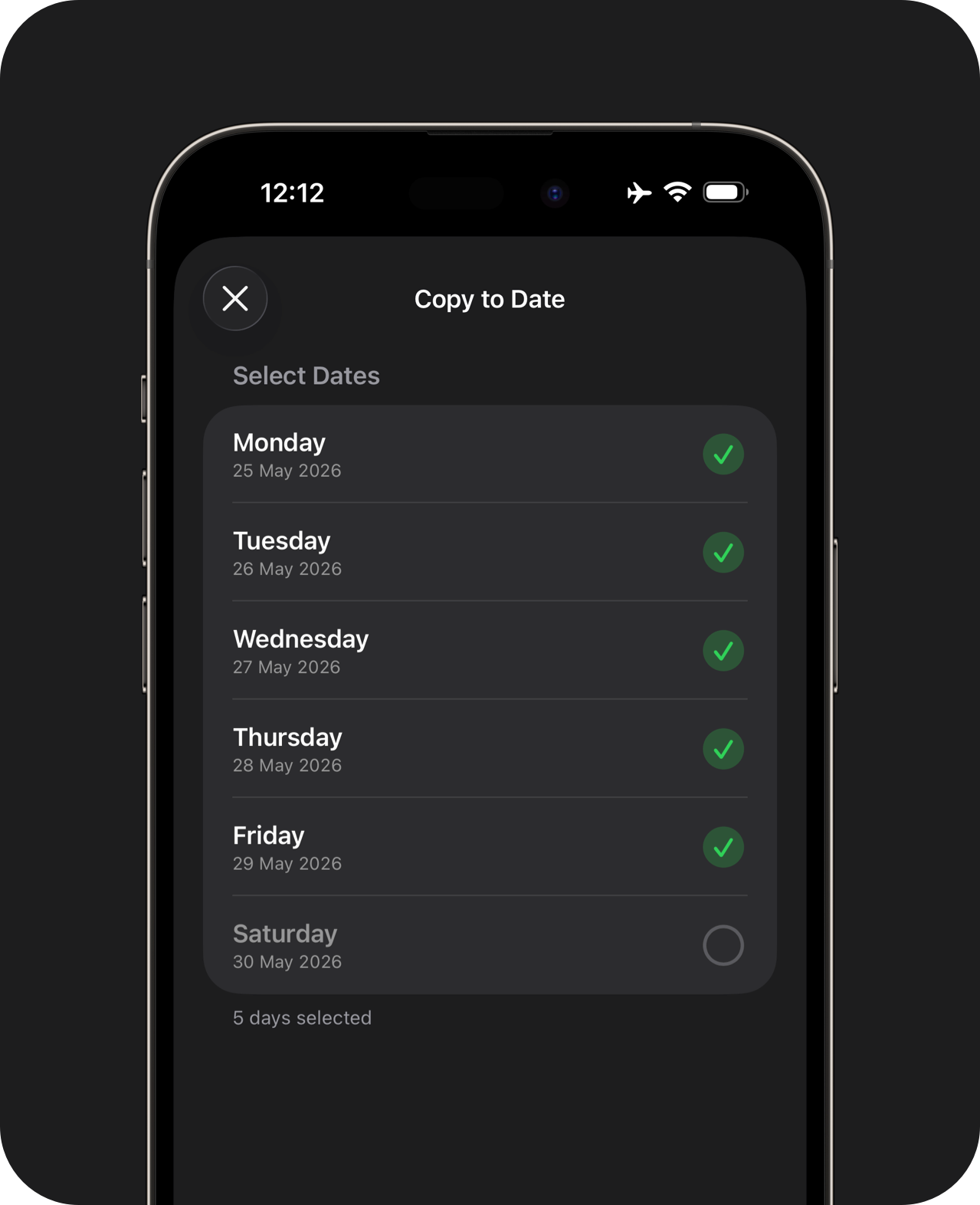 Close-up of an iPhone showing a copy to date confirmation sheet, with multiple days in the coming week selected