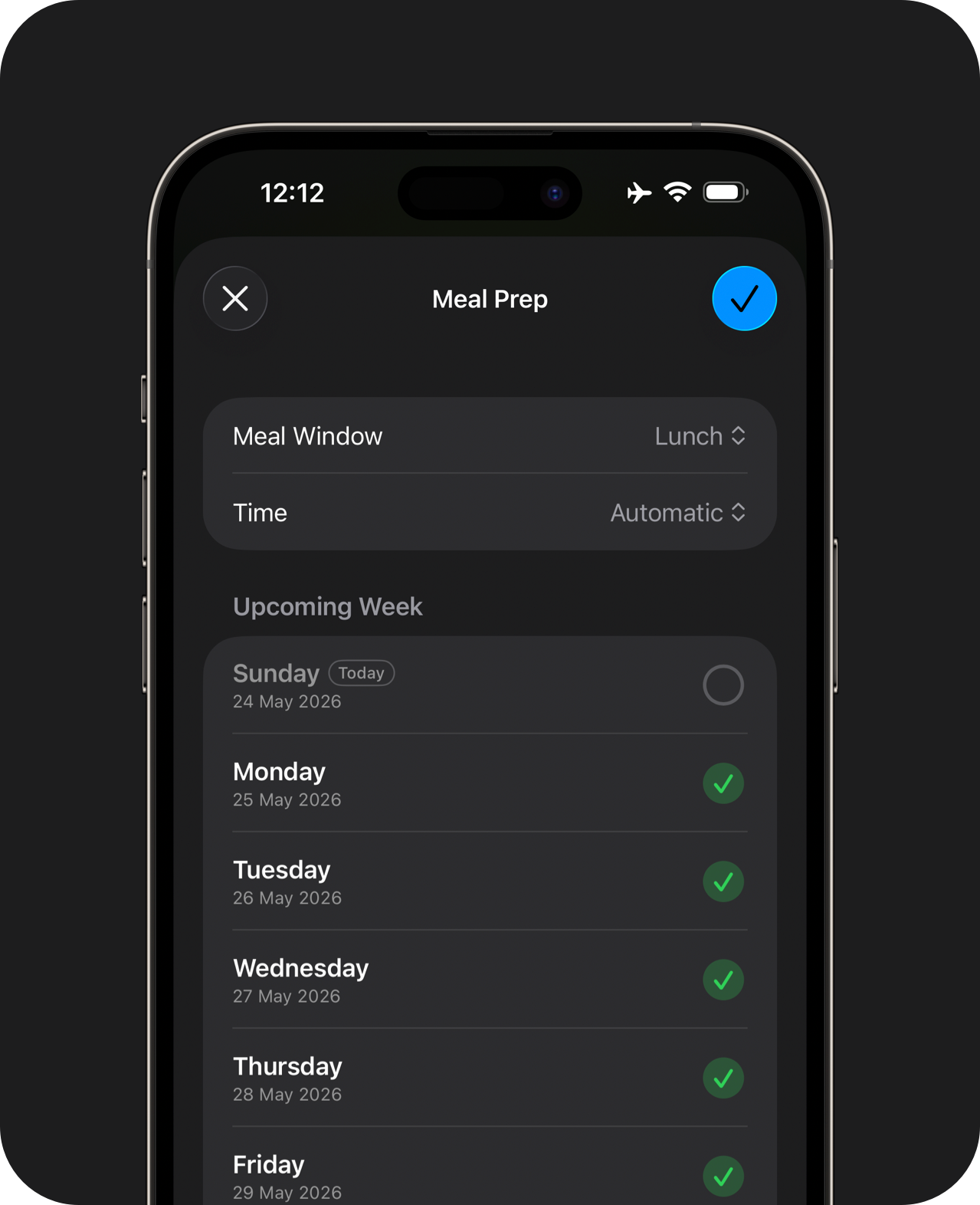 A hand holding an iPhone displaying multi-day meal selection sheet