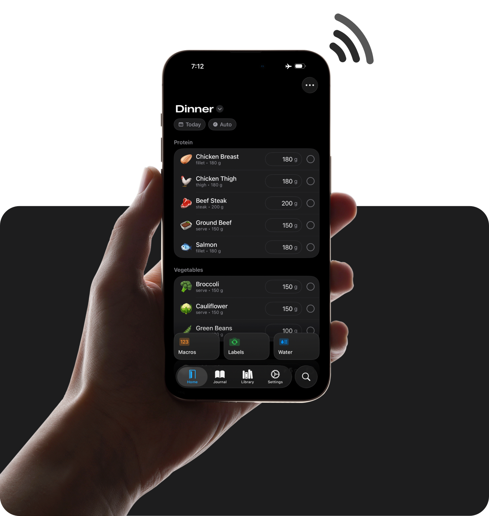 A hand holding an iPhone displaying a custom page for dinner