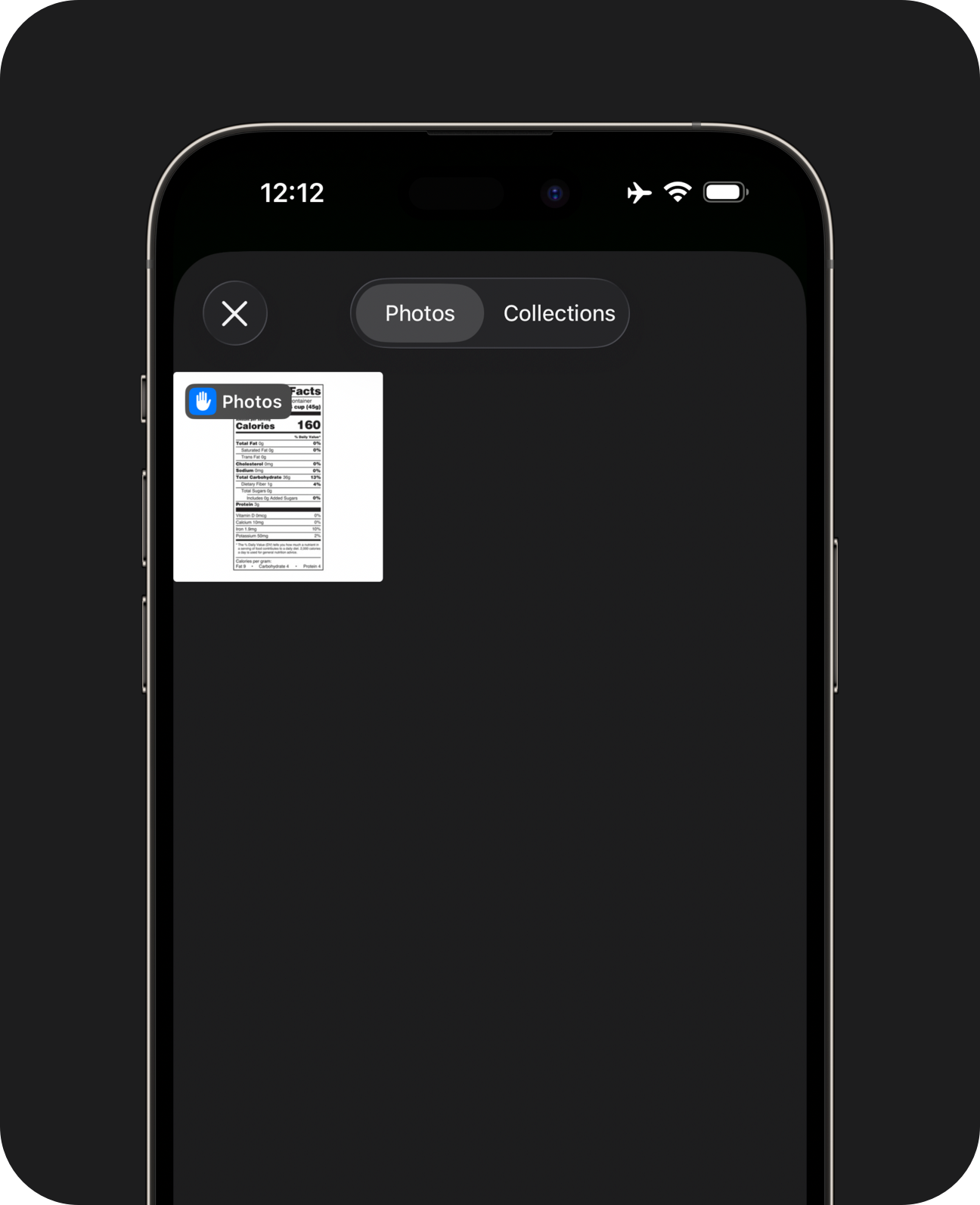 Close-up of an iPhone showing photo library picker sheet