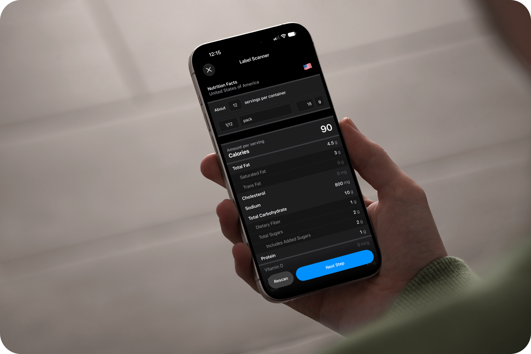 A hand holding an iPhone showing a nutrition label results page